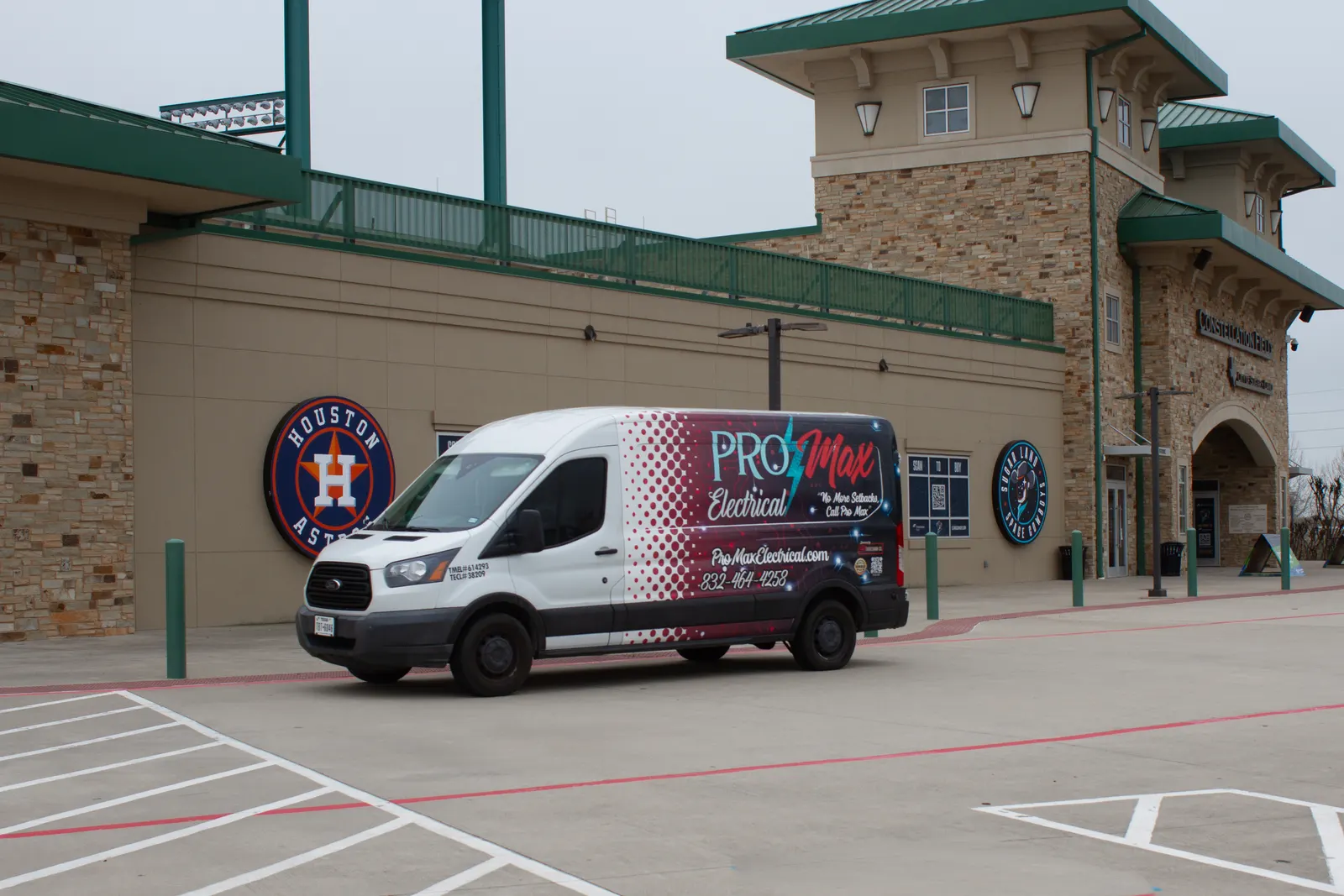 Pro Max Electrical van parked outside a ballpark