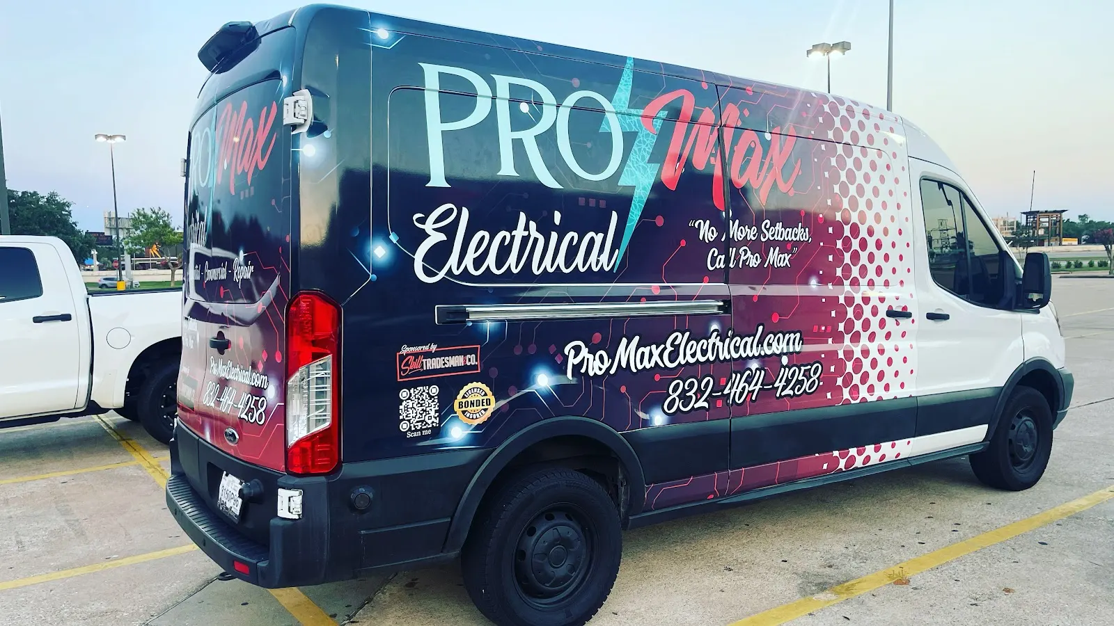 Pro Max Electrical van with its wrap and phone number